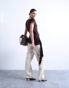 Model wearing Cowl neck lace trim top in chocolate