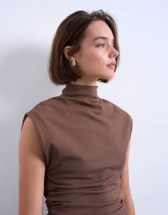 Model wearing Crepe high neck sleeveless tank in brown
