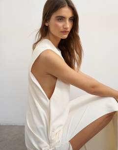 Model wearing Crepe sleeveless twist side maxi dress in ecru
