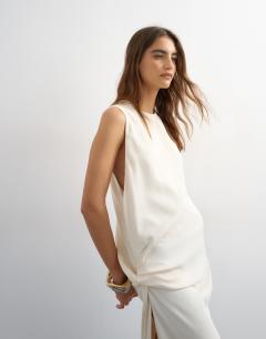 Model wearing Crepe sleeveless twist side maxi dress in ecru