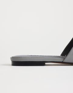 Model wearing Cressida premium real leather square toe mule in grey