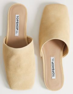 Model wearing Cressida premium real suede square toe mule in camel