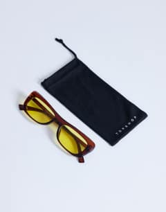 Model wearing Crete cat eye sunglasses in brown