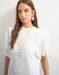 Model wearing Crew neck sheer longline split tunic in white
