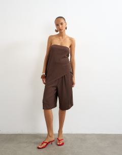 Model wearing Crinkle asymmetric bandeau in chocolate