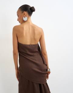 Model wearing Crinkle asymmetric bandeau in chocolate