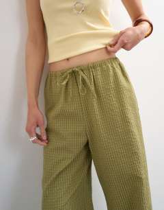 Model wearing Crinkle check drawcord trouser in green