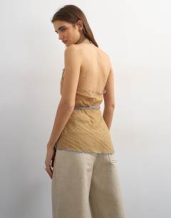 Model wearing Crinkle halter top with contrast trim in taupe