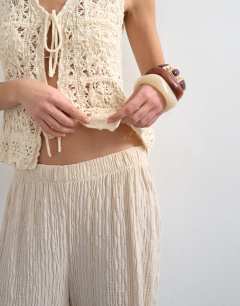 Model wearing Crinkle jersey wide leg trousers in stone