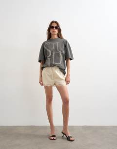 Model wearing Crinkle lace trim short in ecru