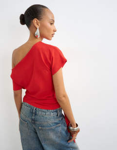 Model wearing Crinkle off shoulder tie front top in red