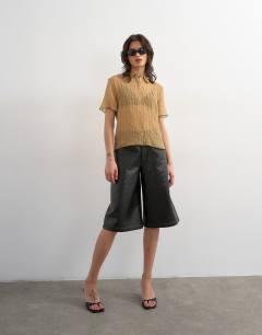 Model wearing Crinkle polo shirt with black tipping in mocha