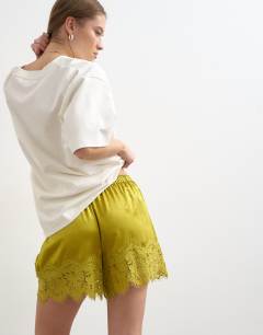 Model wearing Crinkle satin a-line mini short with lace trim in chartreuse 