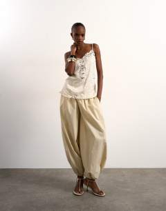 Crinkle satin top with lace inserts in ivory