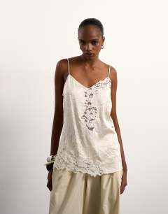 Model wearing Crinkle satin top with lace inserts in ivory