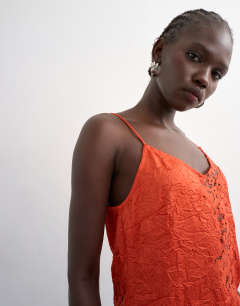 Model wearing Crinkle satin top with lace inserts in rust