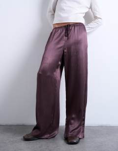 Model wearing Crinkle satin trouser in burgundy
