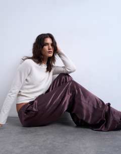Model wearing Crinkle satin trouser in burgundy