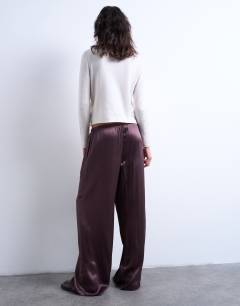 Model wearing Crinkle satin trouser in burgundy