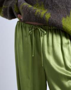 Model wearing Crinkle satin wide leg trouser in bright green