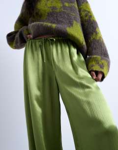 Model wearing Crinkle satin wide leg trouser in bright green