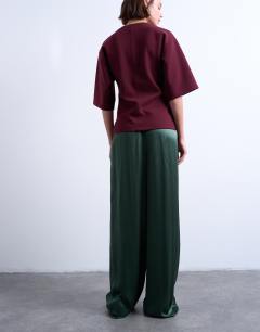 Model wearing Crinkle satin wide leg trouser in green