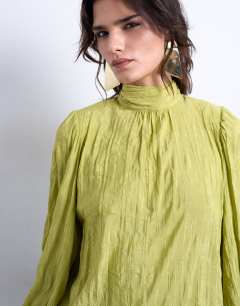 Model wearing Crinkle scarf blouse in green