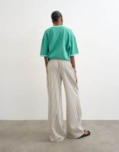 Model wearing Crinkle stripe drawcord trouser in mono