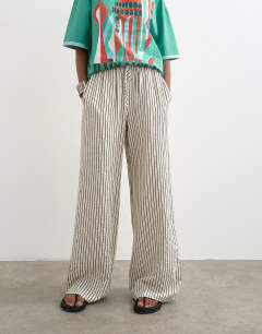 Model wearing Crinkle stripe drawcord trouser in mono