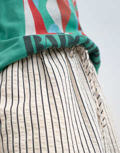 Model wearing Crinkle stripe drawcord trouser in mono