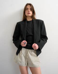 Model wearing Crinkle stripe runner short in mono