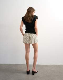 Model wearing Crinkle stripe runner short in mono