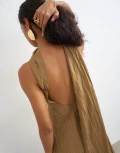 Model wearing Crinkle tuck side twist shoulder bubble hem maxi dress in camel