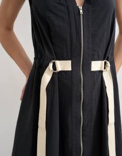 Model wearing Crinkle v neck zip front utility maxi dress in black