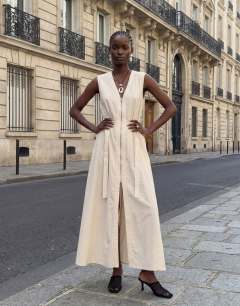 Model wearing Crinkle v neck zip front utility maxi dress in ecru