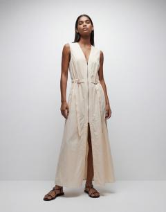 Model wearing Crinkle v neck zip front utility maxi dress in ecru
