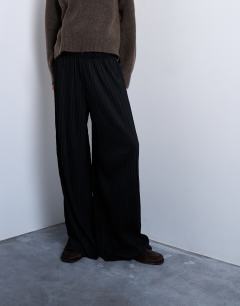 Model wearing Crinkle wide leg trousers in black