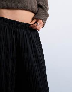 Model wearing Crinkle wide leg trousers in black