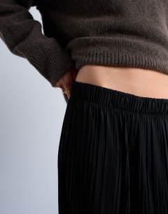 Model wearing Crinkle wide leg trousers in black