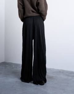Model wearing Crinkle wide leg trousers in black