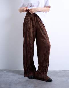 Model wearing Crinkle wide leg trousers in chocolate brown