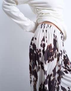 Model wearing Crinkle wide leg trousers in cow print