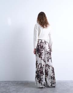 Model wearing Crinkle wide leg trousers in cow print