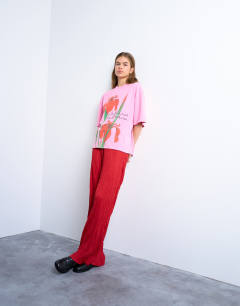 Model wearing Crinkle wide leg trousers in red