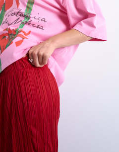Model wearing Crinkle wide leg trousers in red