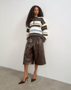 Model wearing Croc faux leather a line bermuda in chocolate