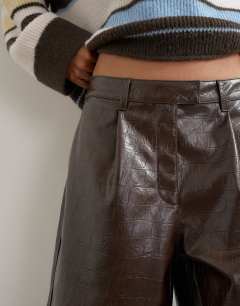Model wearing Croc faux leather a line bermuda in chocolate