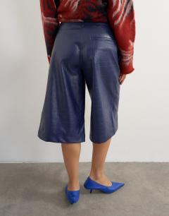 Model wearing Croc faux leather bermuda short in navy