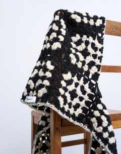 Model wearing Crochet balaclava in black & cream