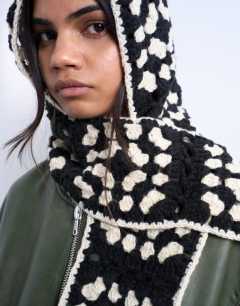 Model wearing Crochet balaclava in black & cream